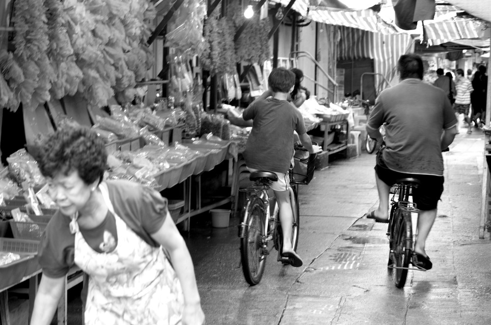 Tai O street cyclist